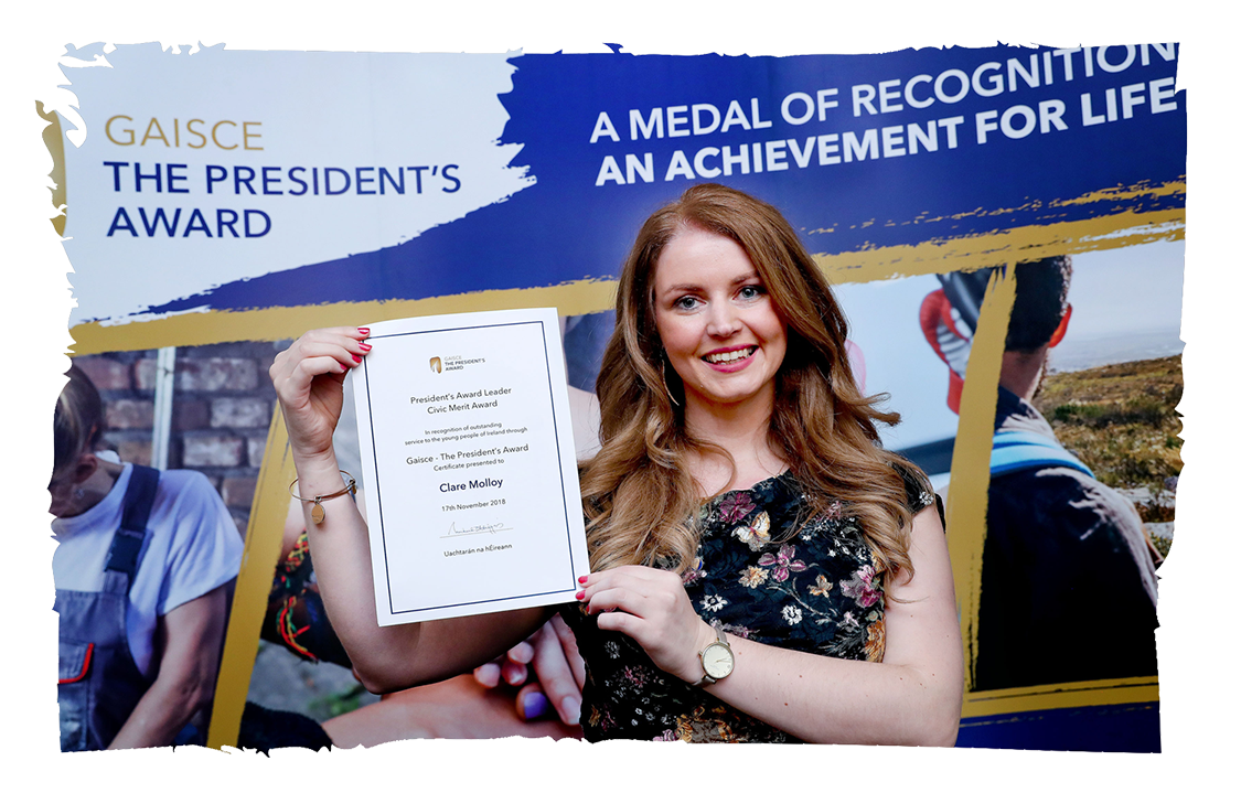 Clare Molloy Young women holding a certificate