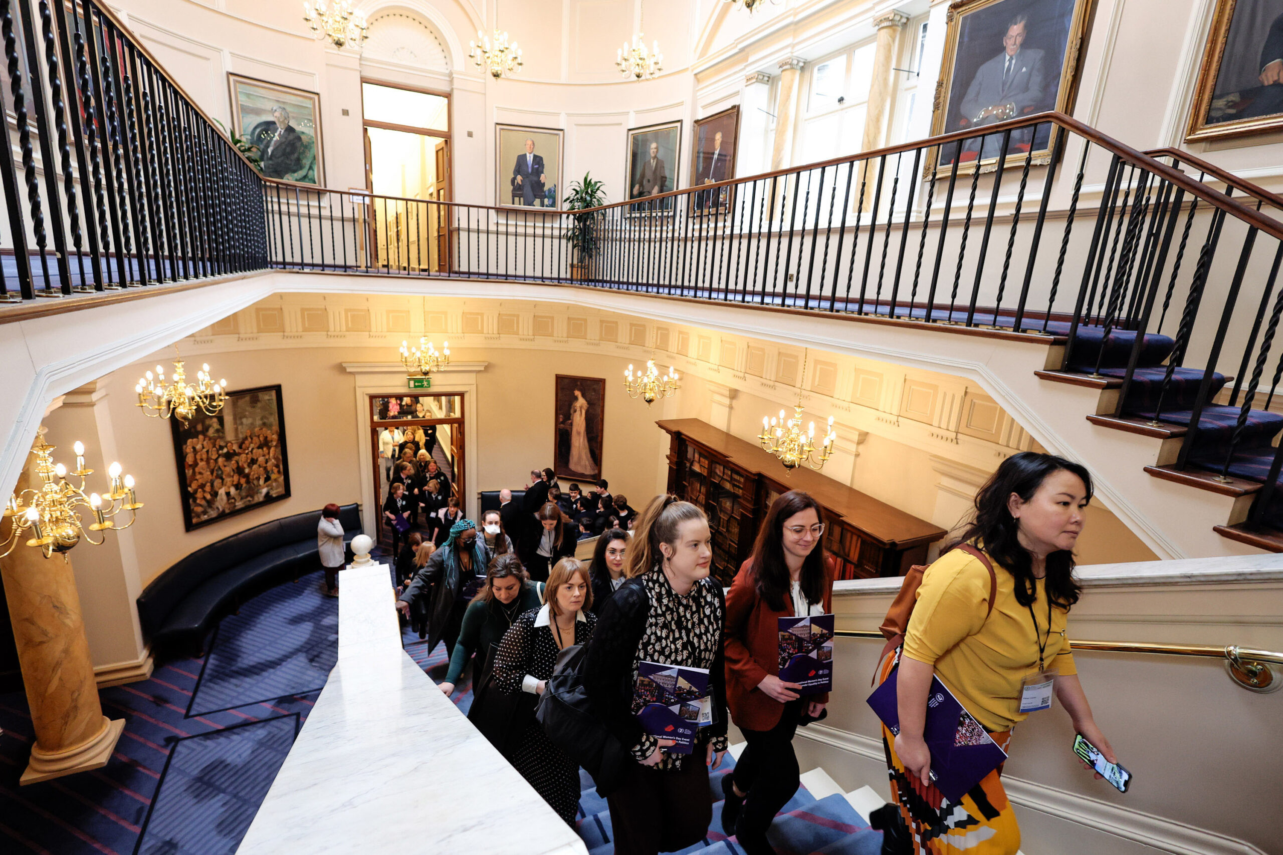A line of women ascending the stairs of Leinster House, on their way to enter the Dáil floor.